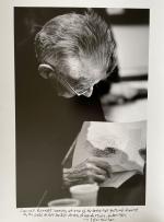[Beckett, "Samuel Beckett looking at one of his books that featured drawings by the Paris Artist Avigdor Arikha